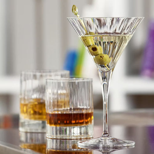 Elegant martini glass with olives. Fluted glass design.