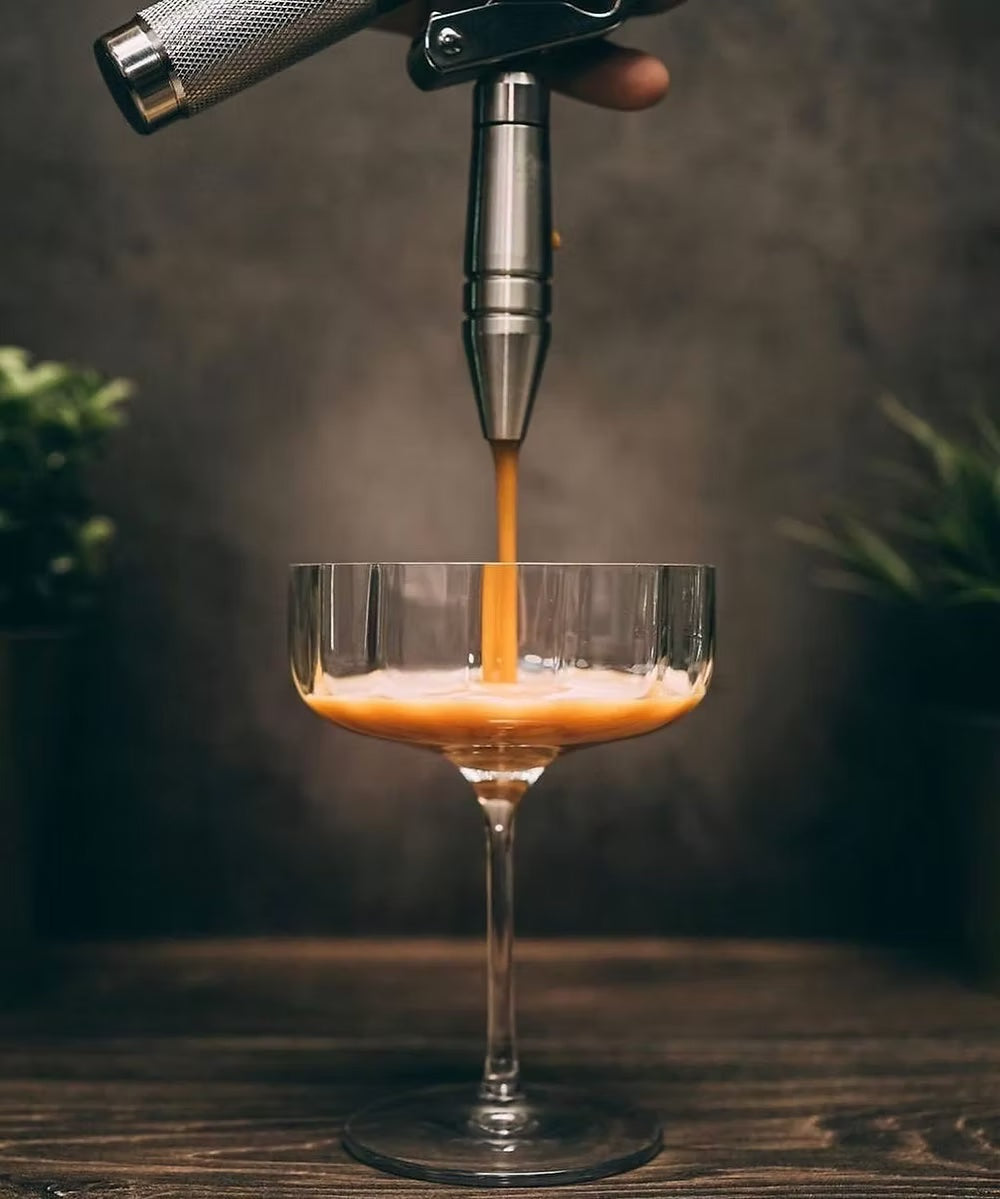Bartender pouring drink in Jazz cocktail glass.