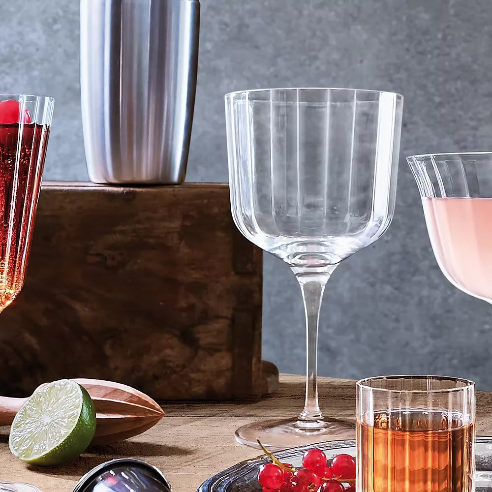 Set of four clear ribbed Bach Gin Glasses.