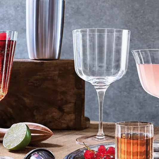 Set of four clear ribbed Bach Gin Glasses.