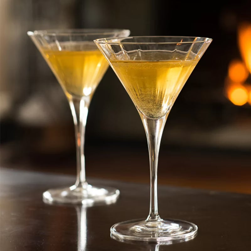 Elegant martini glasses with long stems, part of a set of four.