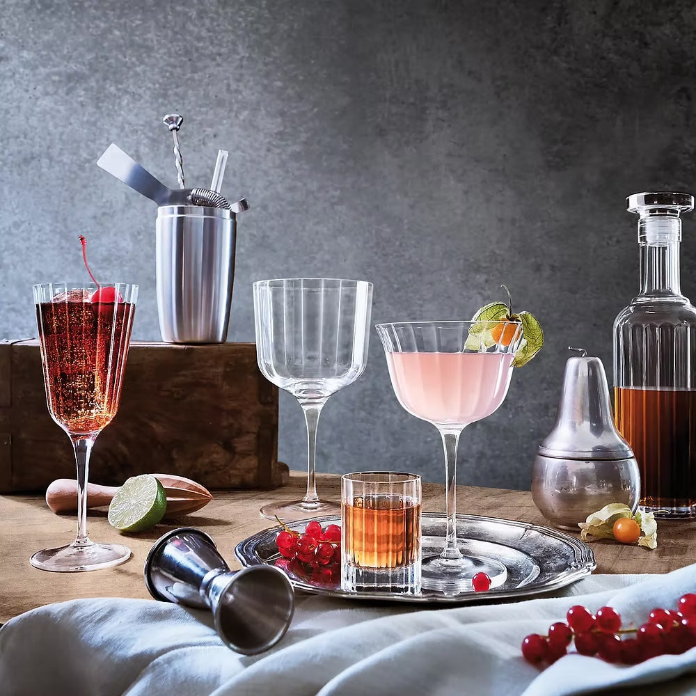 Bach Gin Glasses: Elegant ribbed glassware for cocktails and spirits.