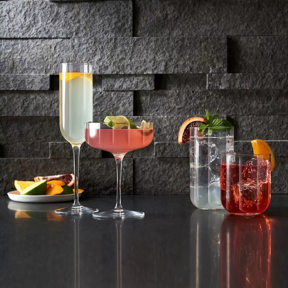 Luigi Bormioli Jazz set with cocktail drinks and fruit garnish.