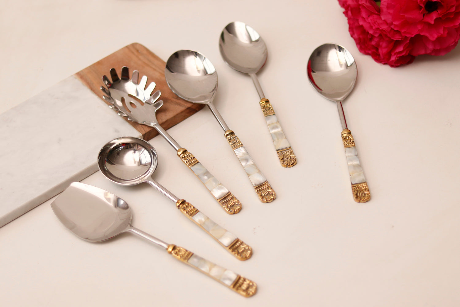 Elegant serving spoon set with mother of pearl and gold accents