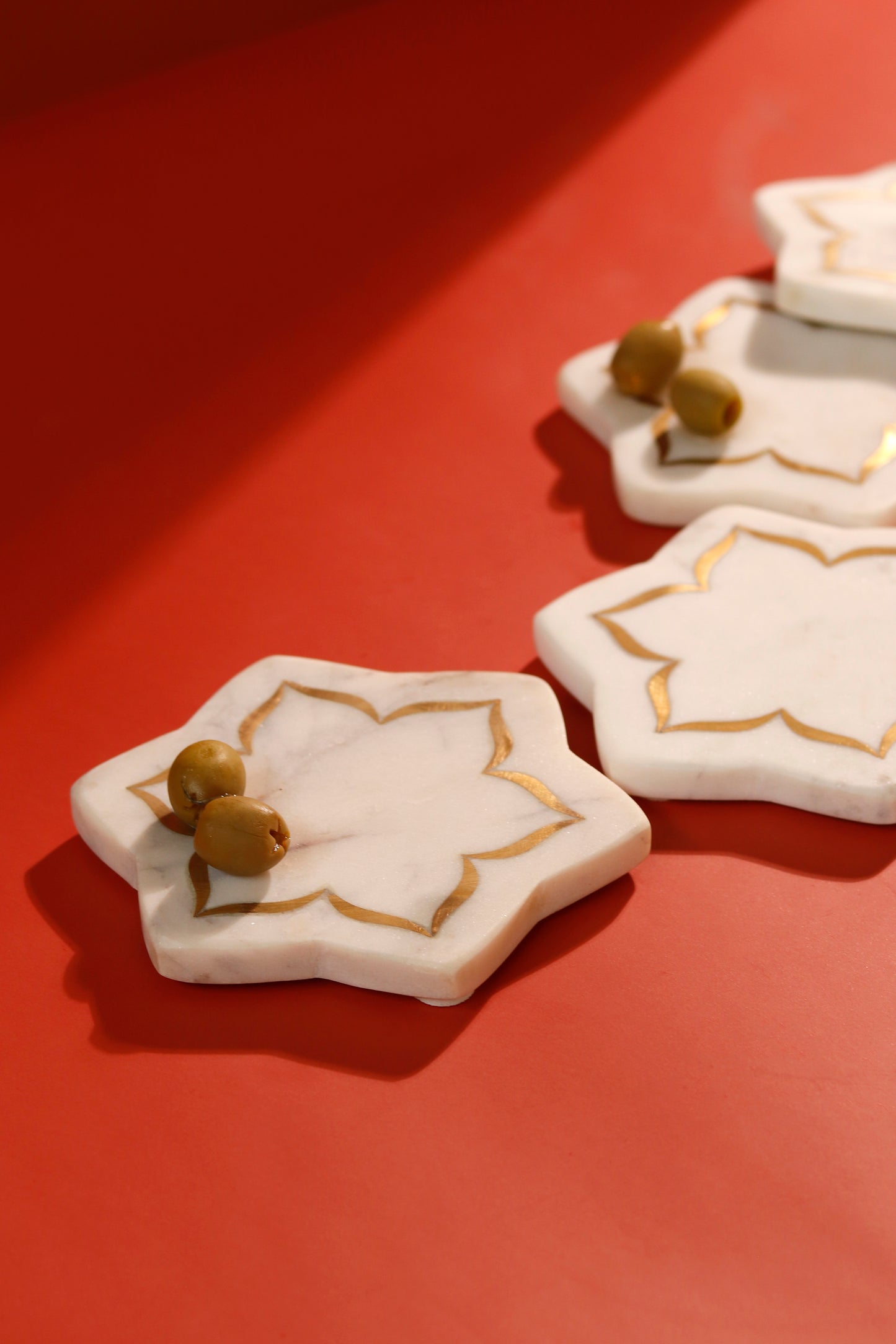 Lotus coasters with brass inlay, marble texture.