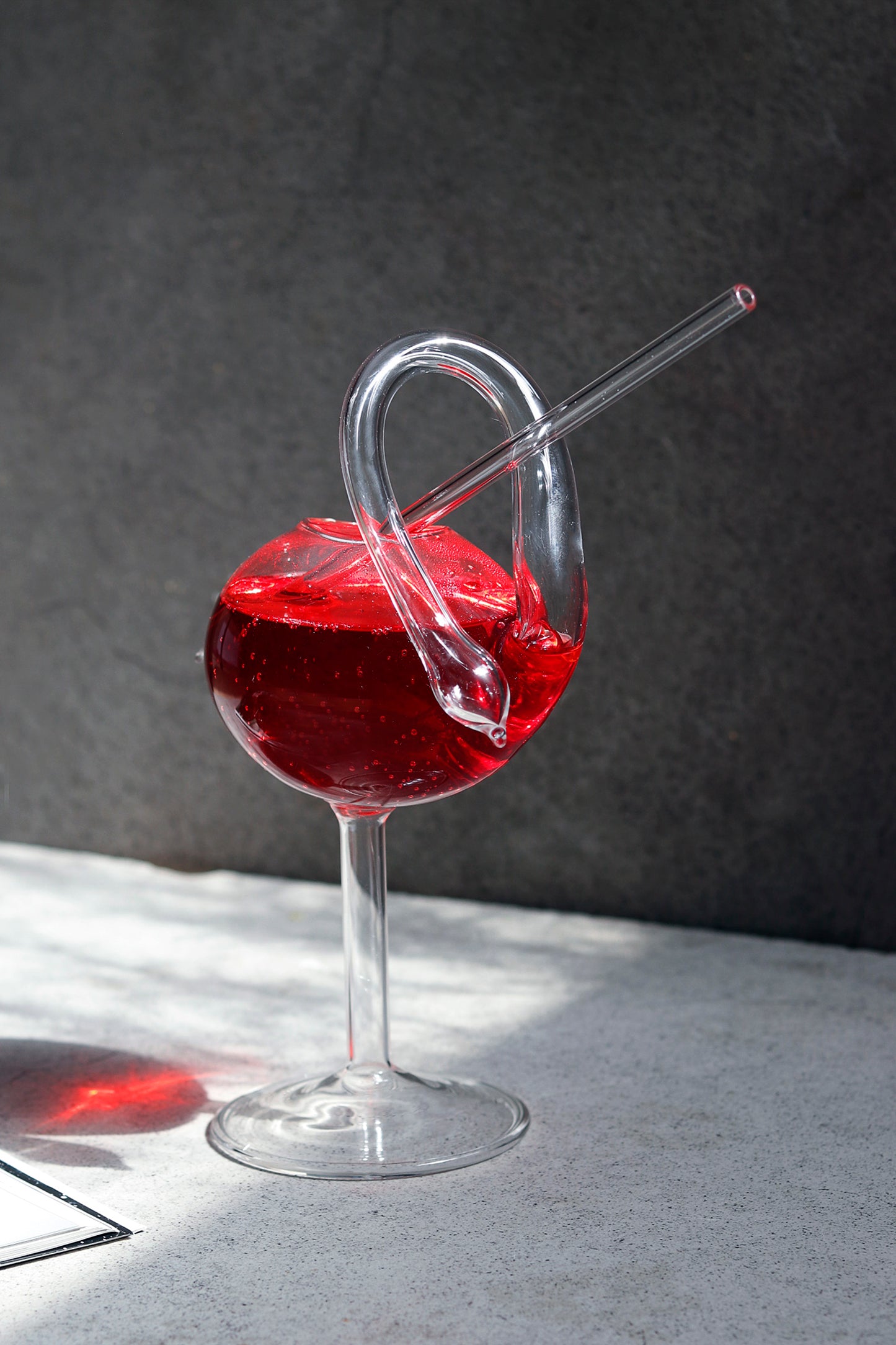 Elegant swan cocktail glass with a unique design and built-in straw.