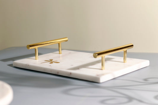 Marble tray with gold dragonfly and handles.