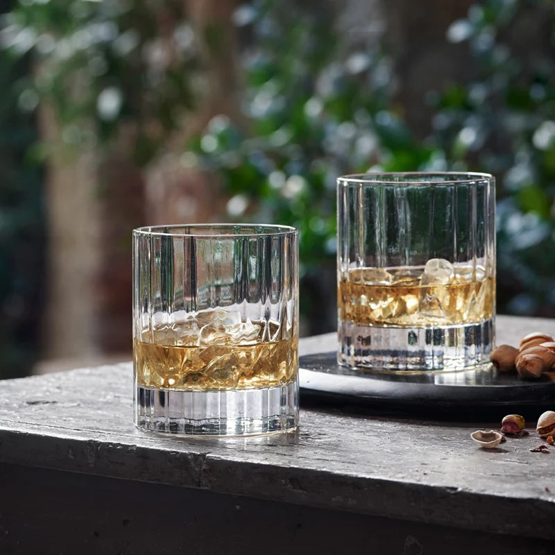 Close-up of ribbed Bach old fashioned tumblers with beverage