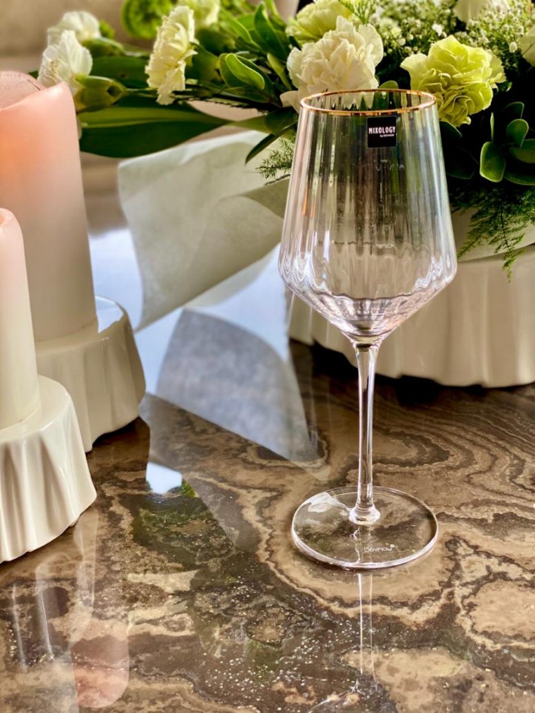 Elegant white wine glass with gold rim detail