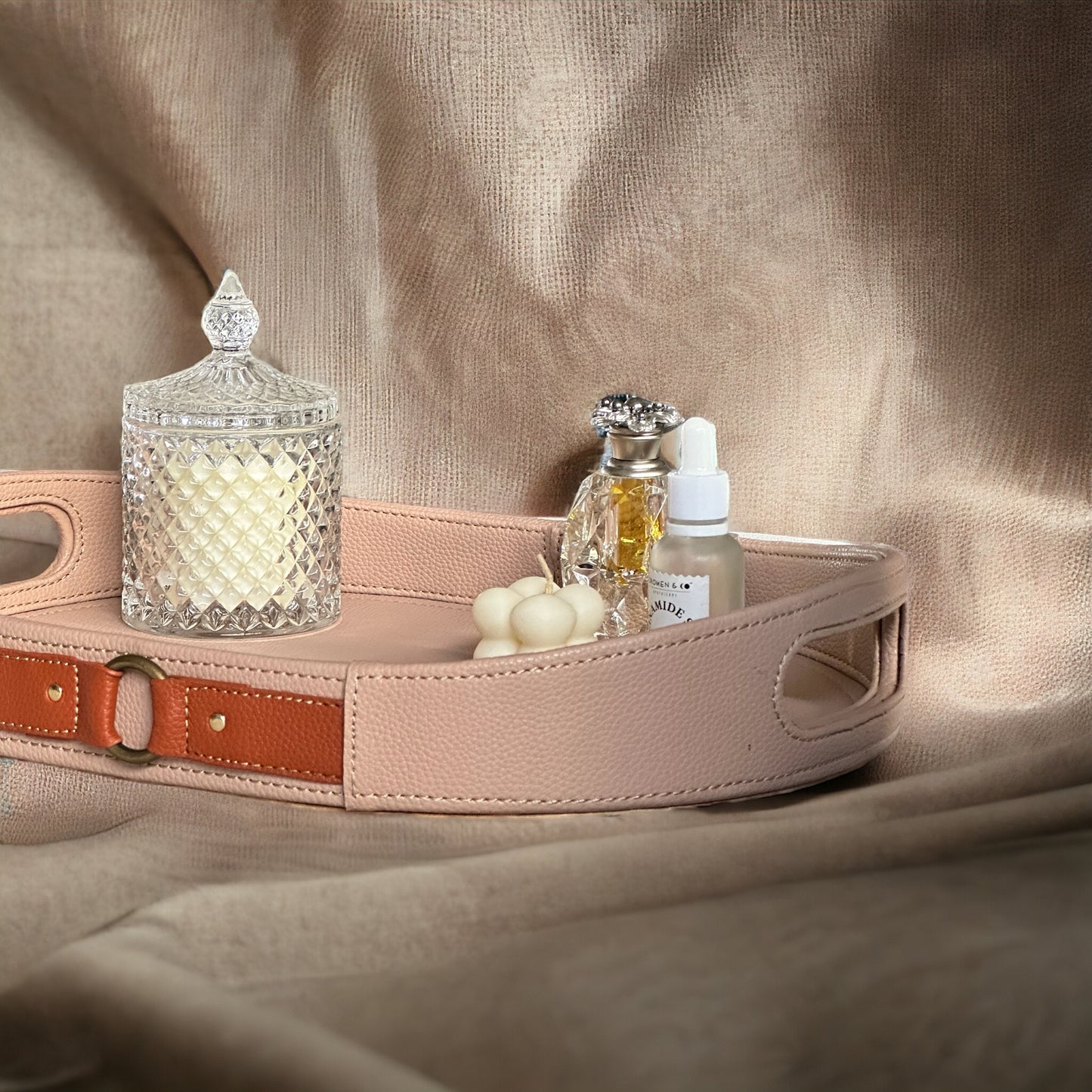Beige Luxora leather tray with cutout handles and brown leather accents.