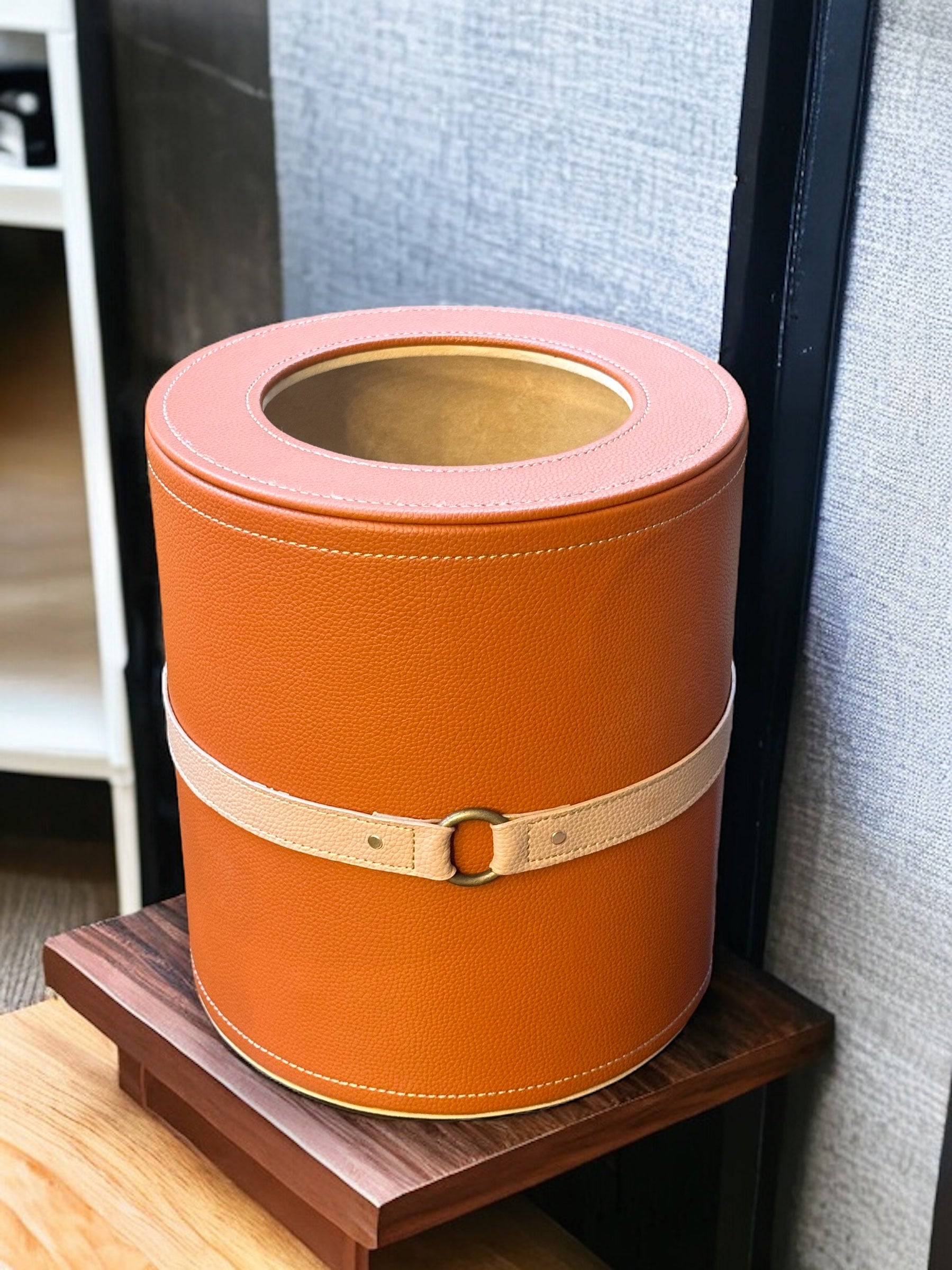 Cognac Luxora wastebin featuring belted accent, stylish container.