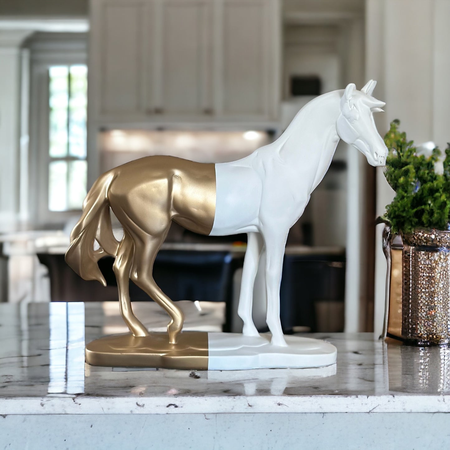 Elegant horse sculpture, white and gold finish.