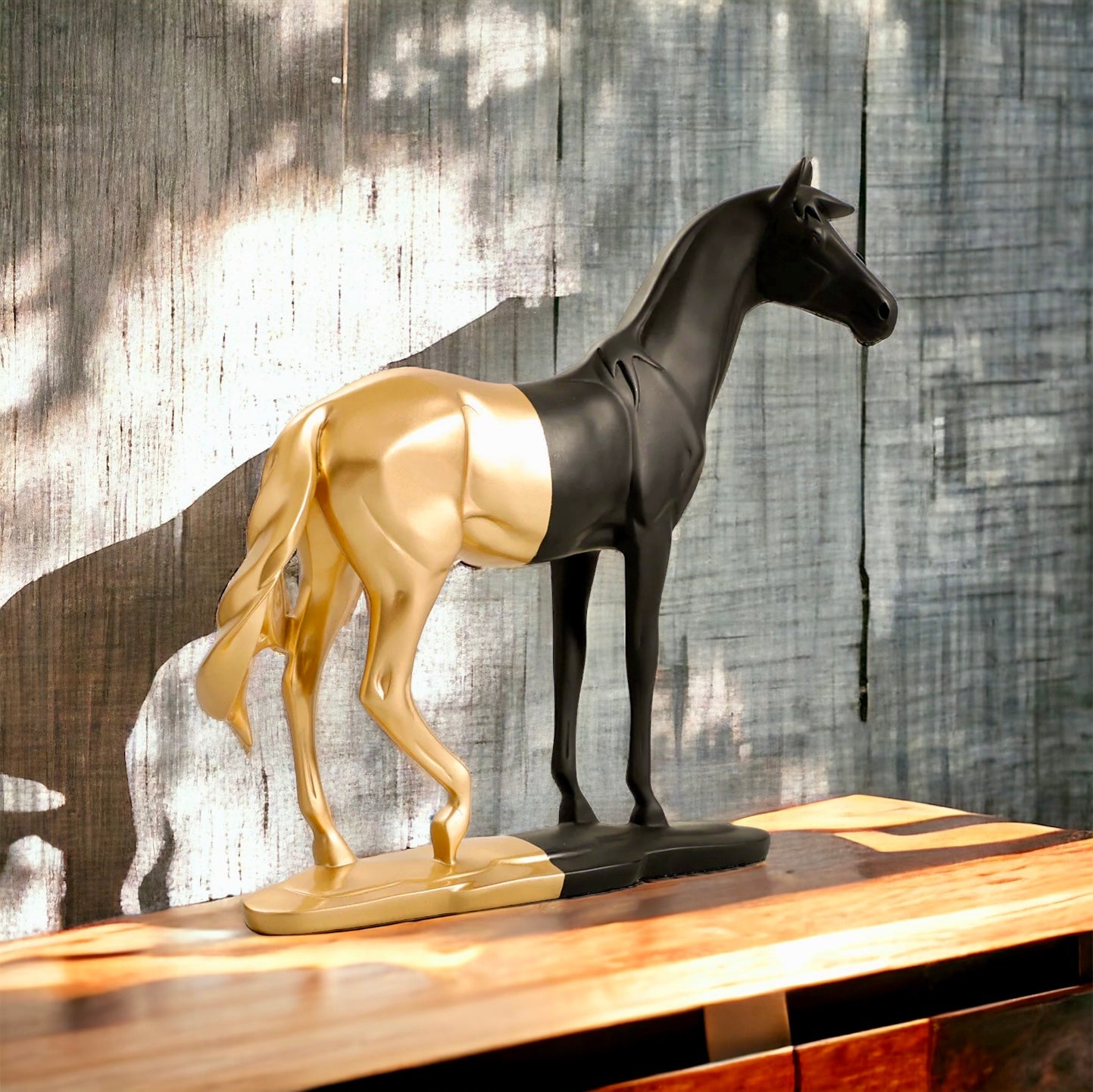 Black and gold Roman horse sculpture on display.