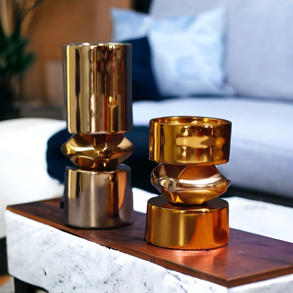 Modern metal candle stands, gold and nickel finish, geometric accent.