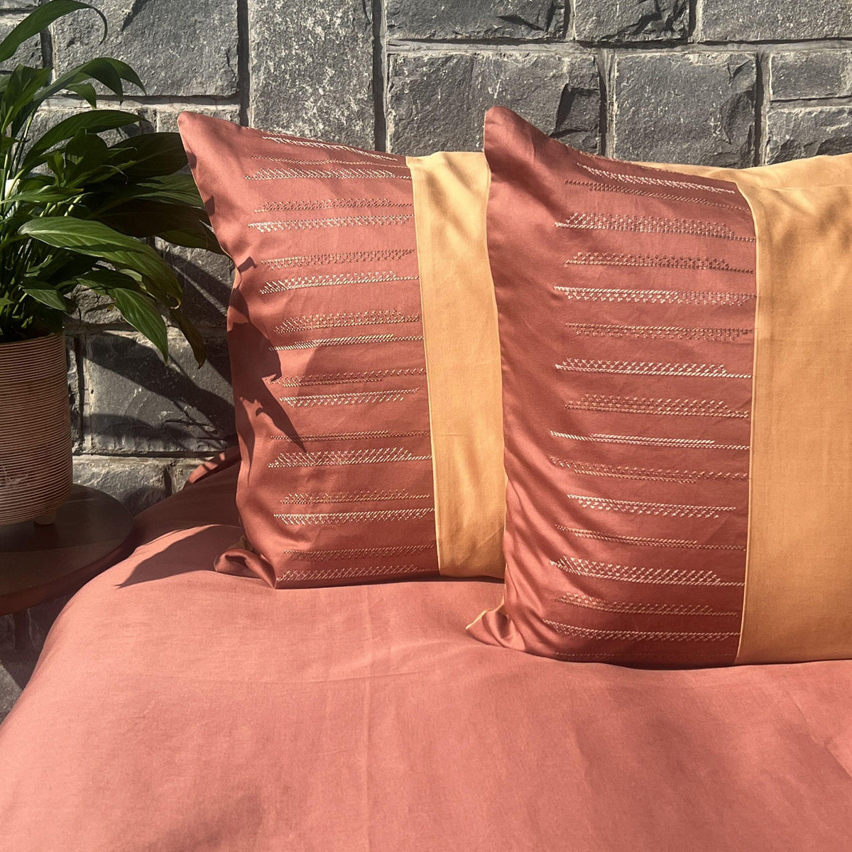 Full bed styled with Speckle terracotta and honey mustard bedsheet set