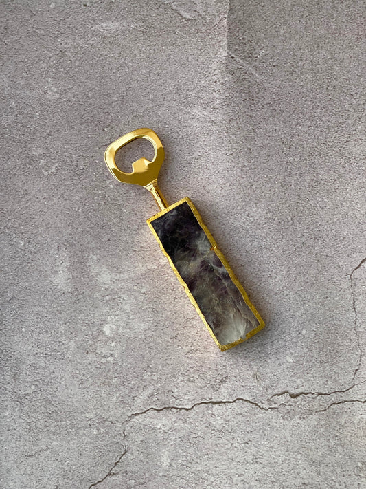 Stylish amethyst bottle opener with gold finish metal.