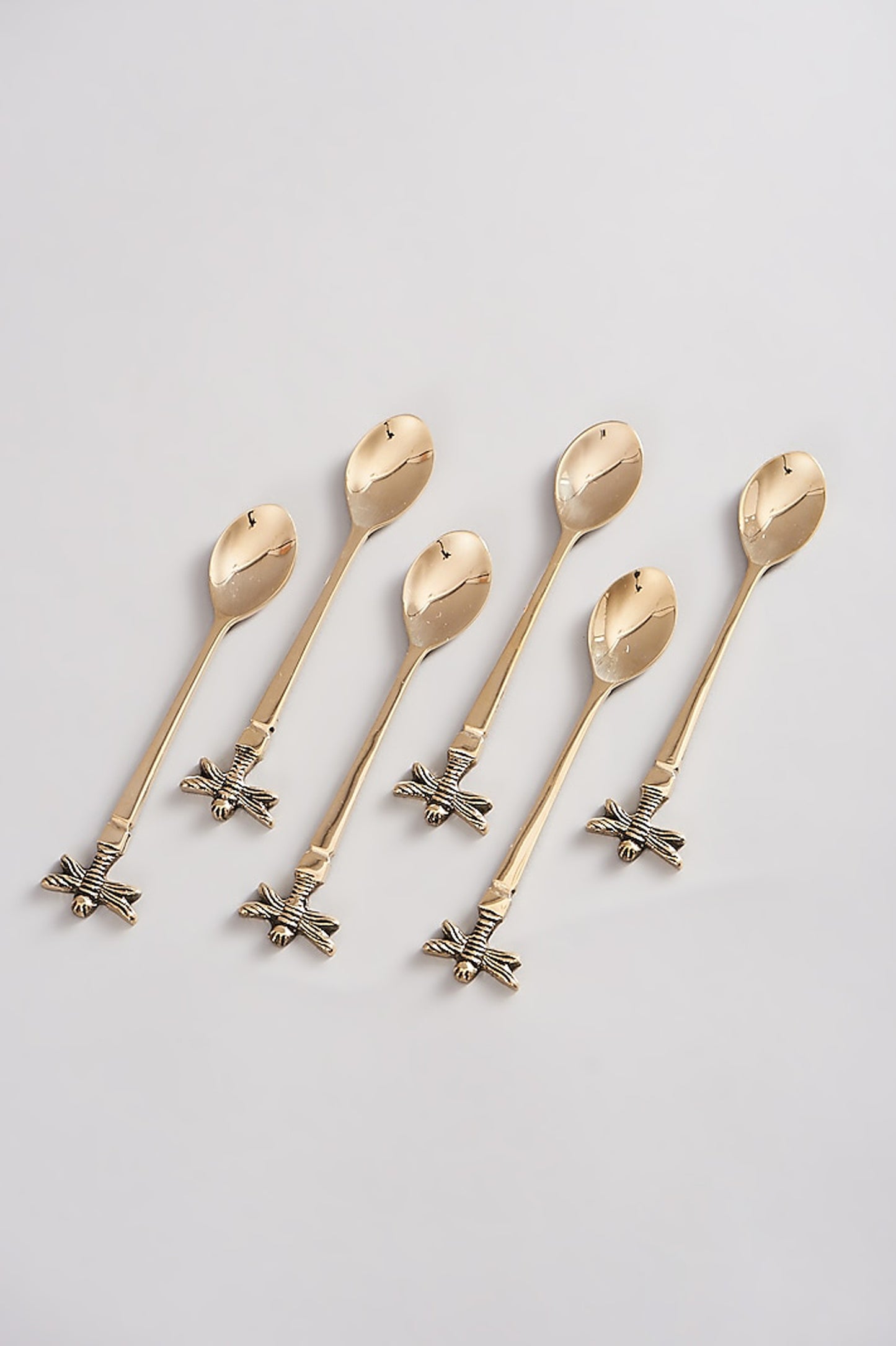 Auric tea spoons set featuring a unique bee design handle.