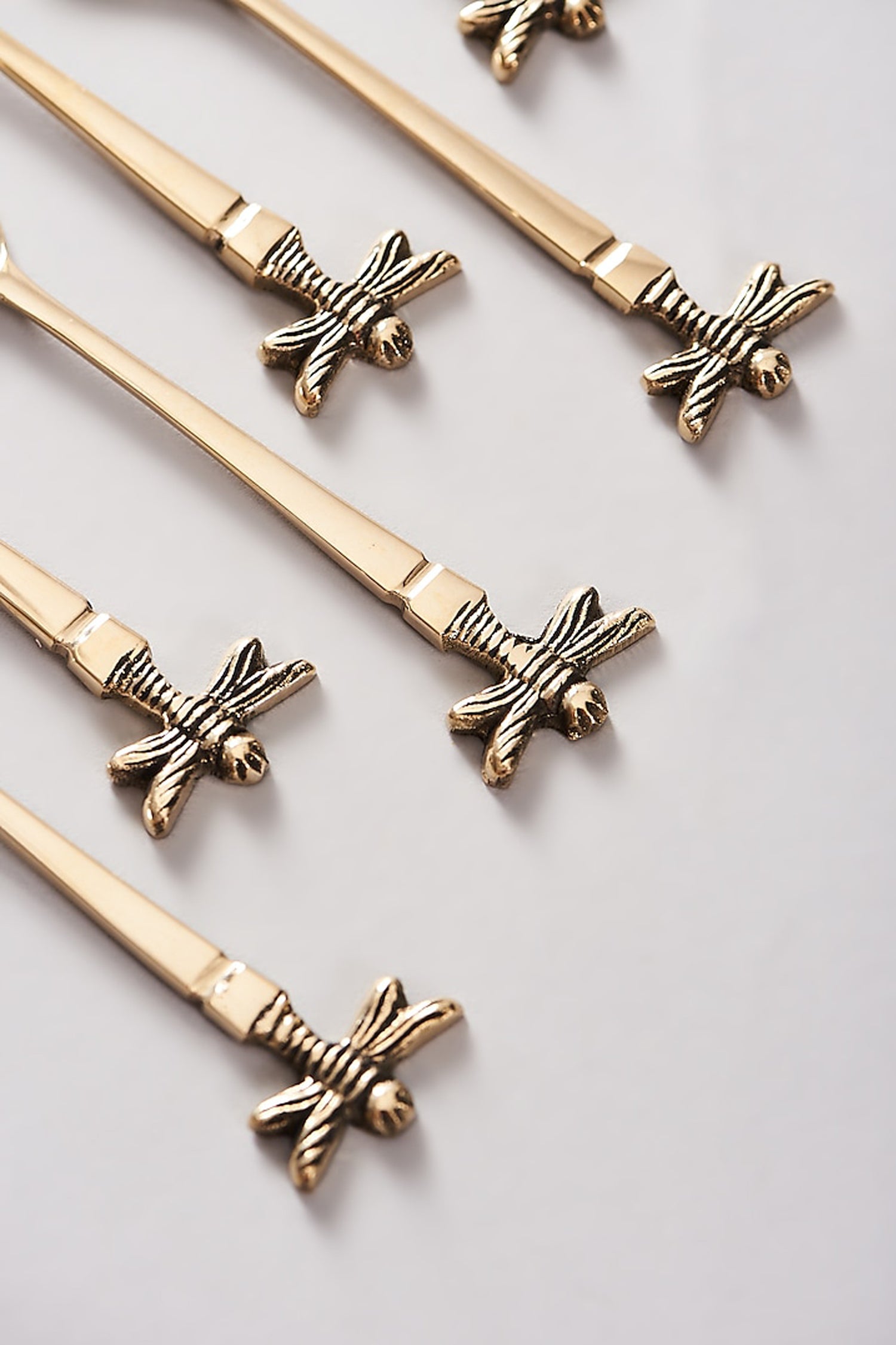 Elegant gold tea spoons with dragonfly handles, set of six.