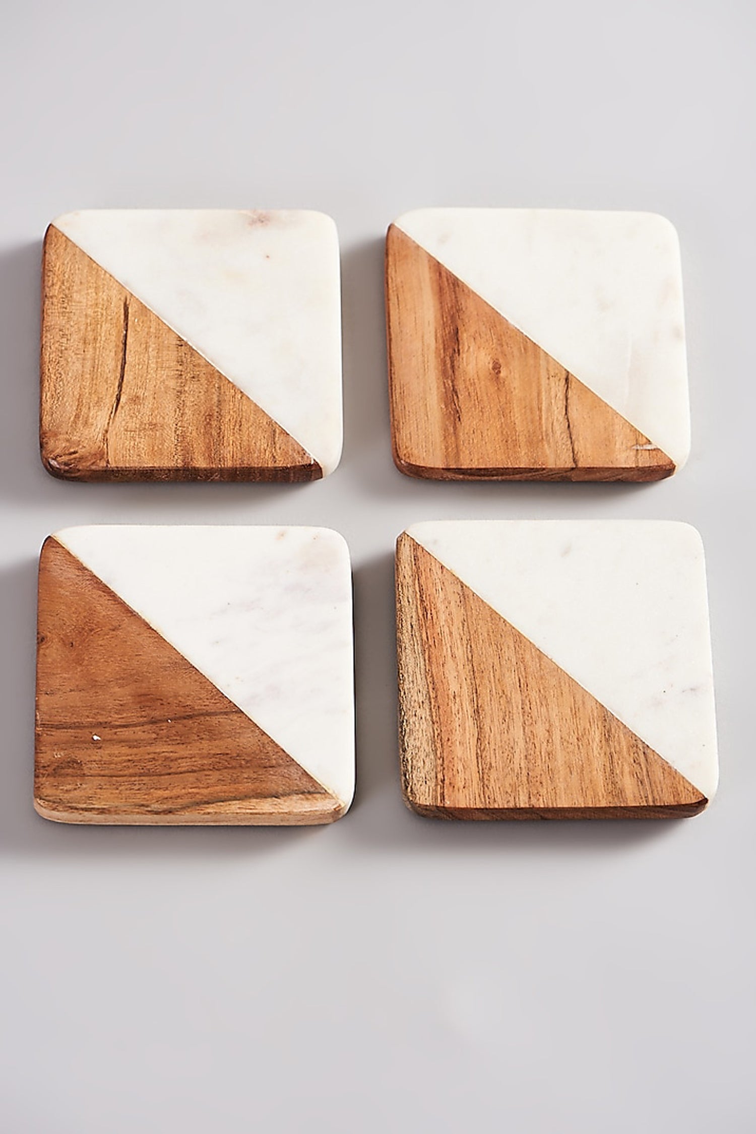 Set of four wood and marble drink coasters.