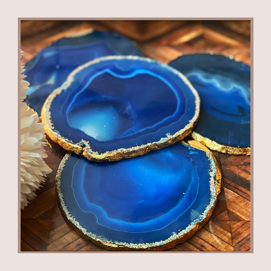 Blue agate coasters with gold trim, set of four.