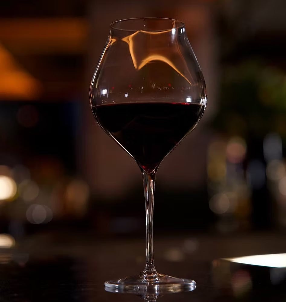 Close-up of Luigi Bormioli Amarone red wine glass.