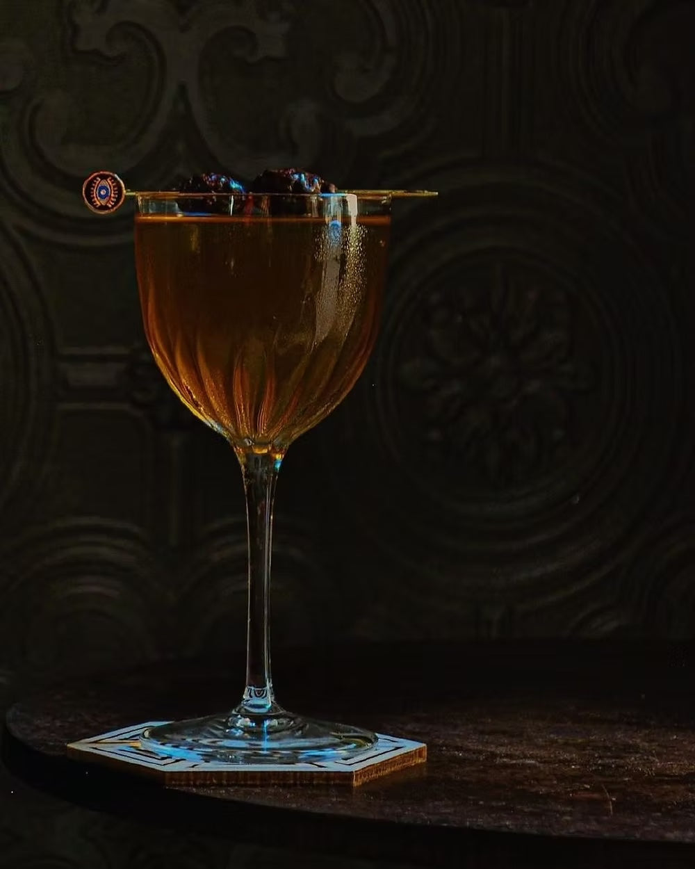 Elegant NICK & NORA cocktail glass with garnish pick from Mixology set.