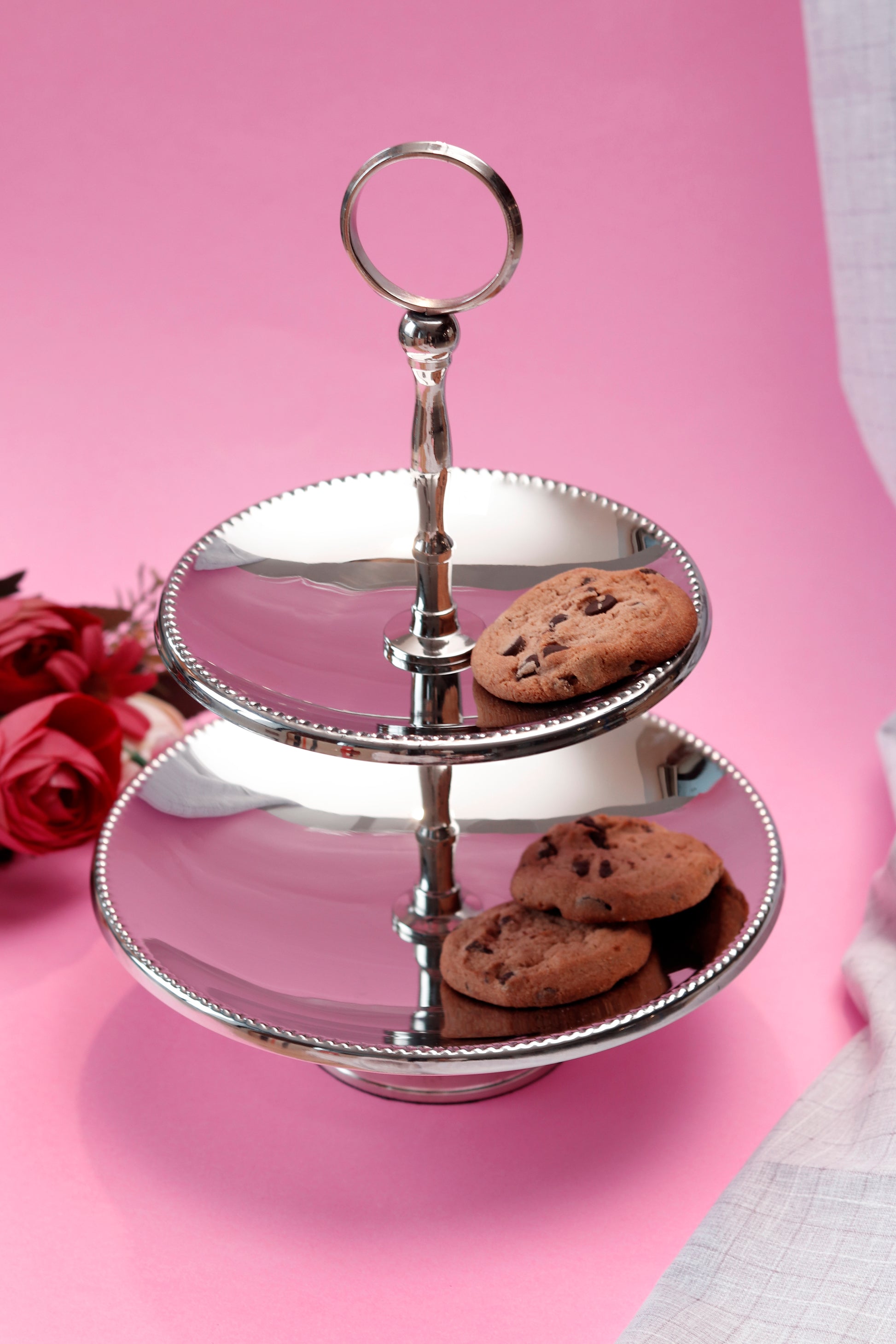 Elegant two tier cookie stand with silver finish.