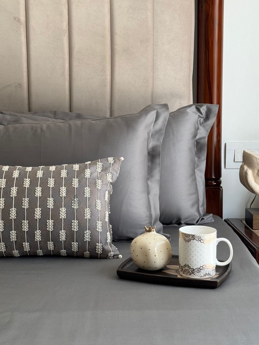 Elephant grey bedsheet set styled on a bed