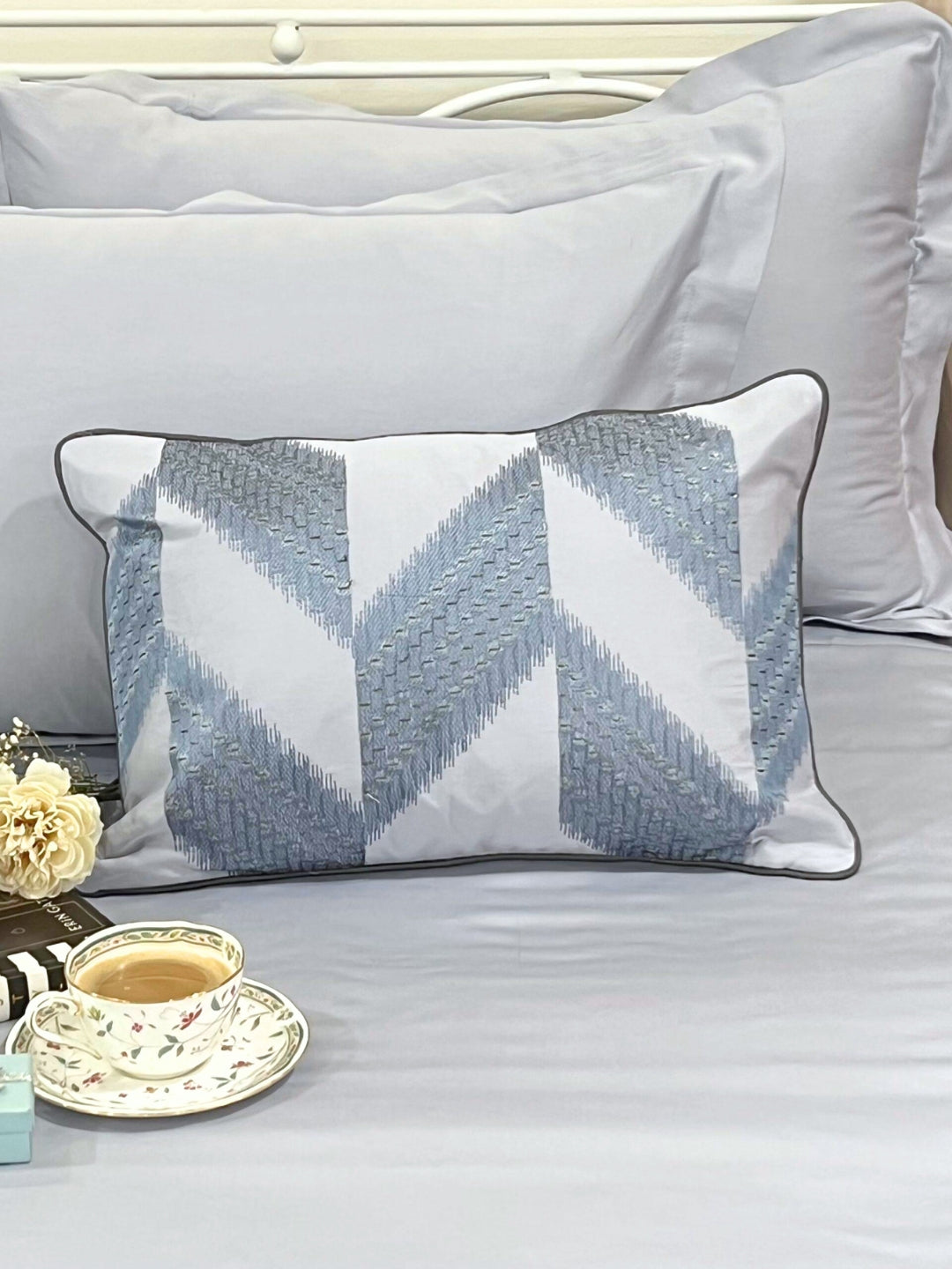 Close-up of smoke blue embroidered accent cushion cover