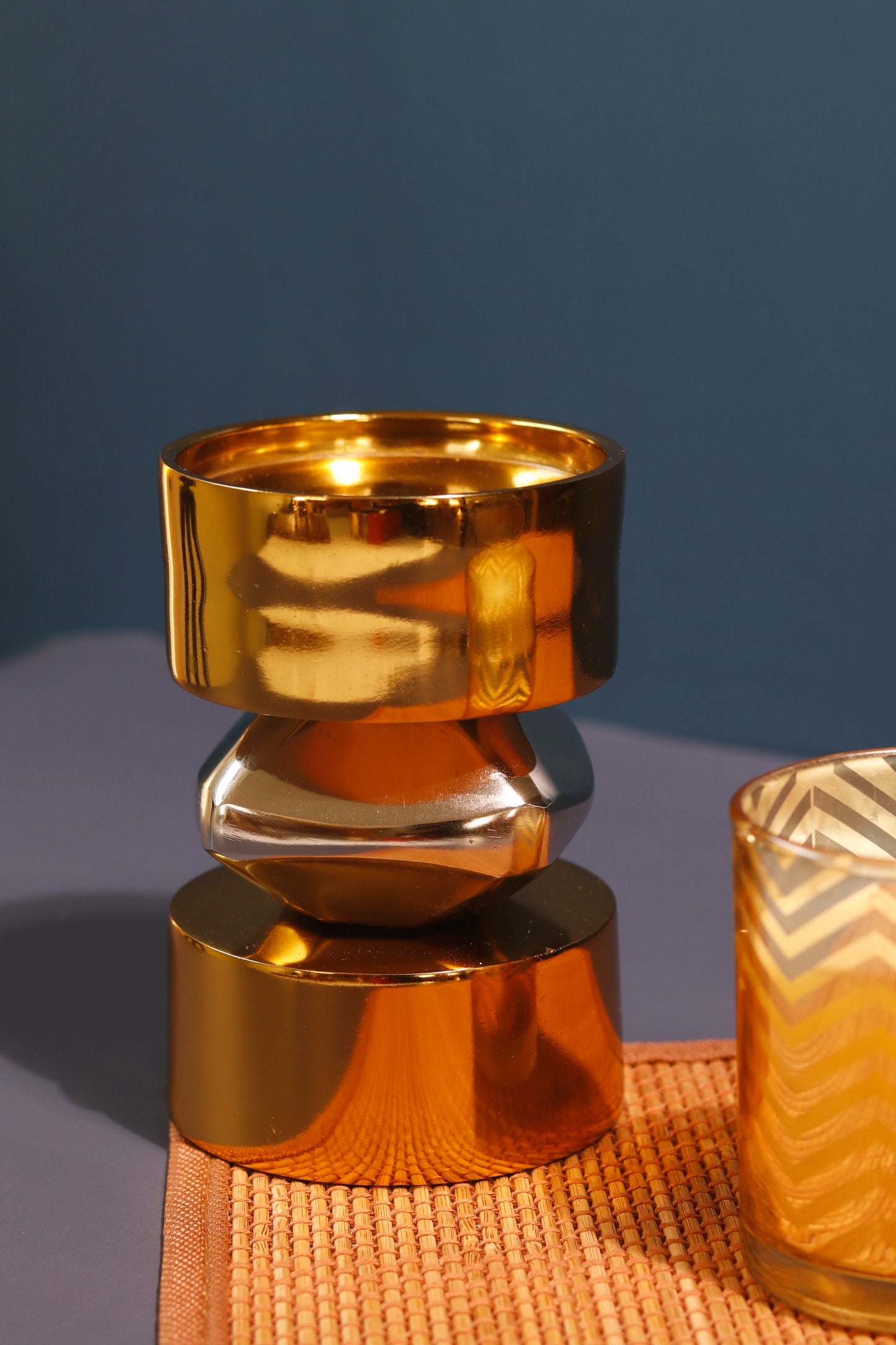 Elegant gold and nickel metal candle stand.
