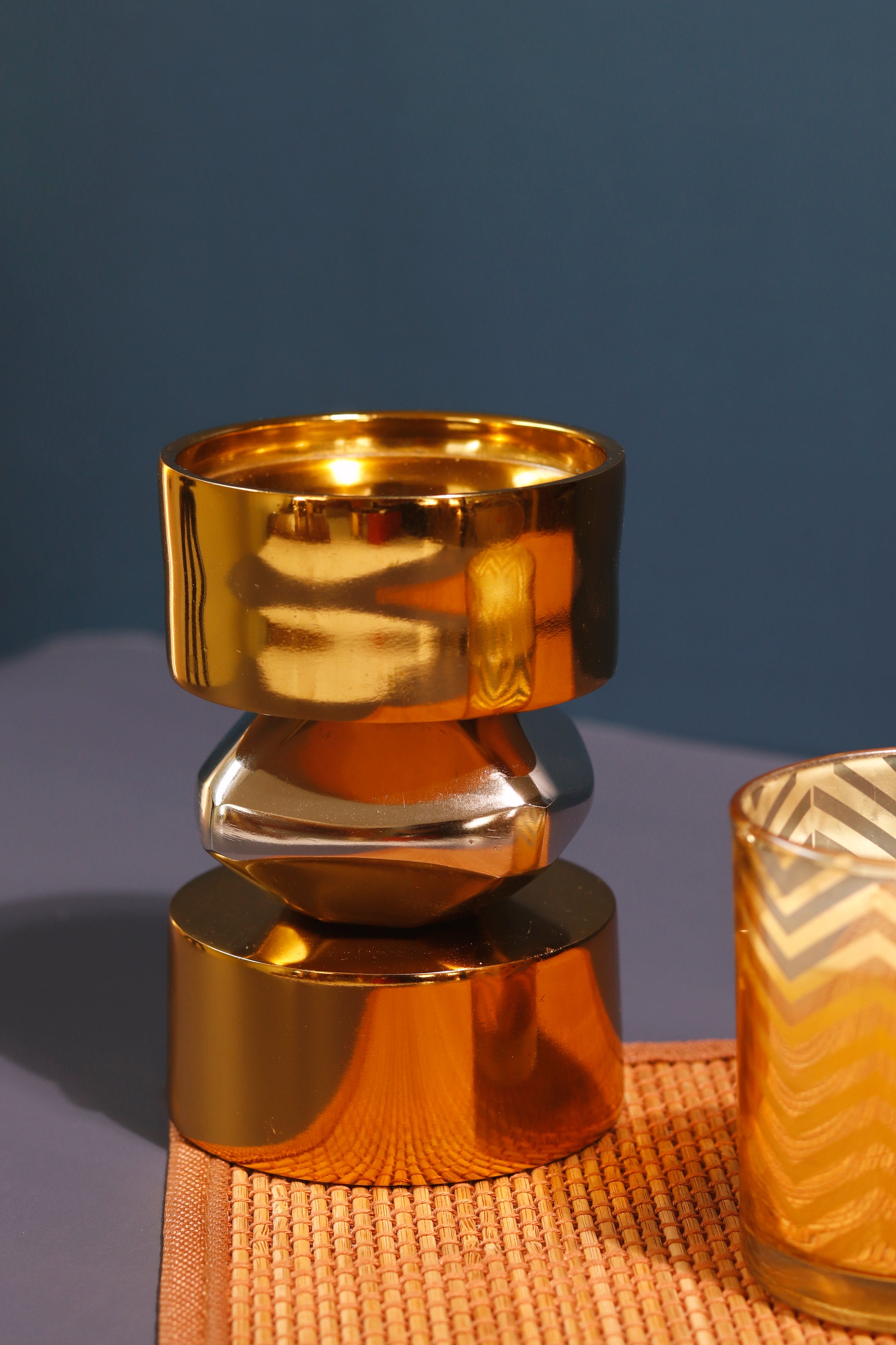 Elegant gold and nickel metal candle stand.