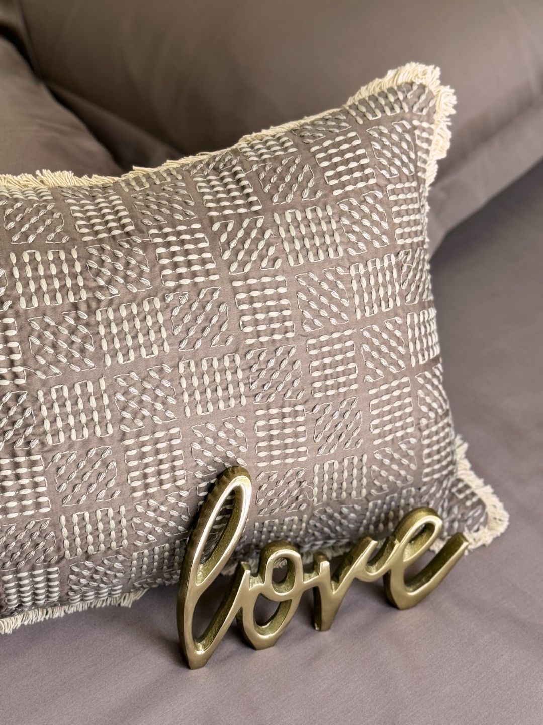 Close-up of taupe cotton satin fabric texture