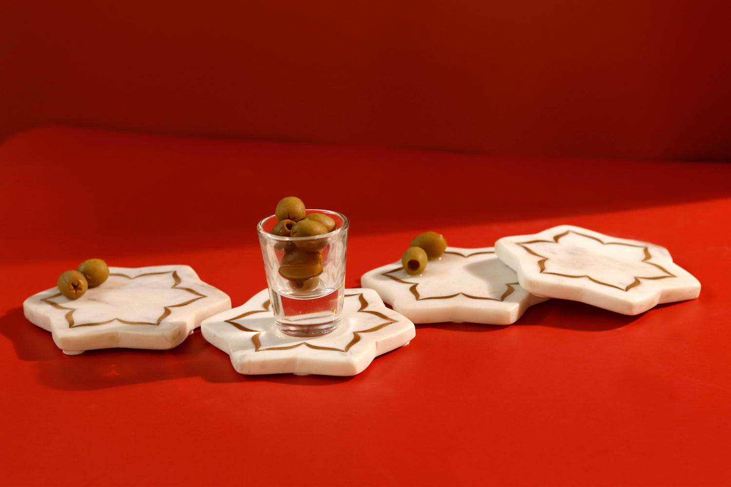 Lotus shaped coasters featuring brass inlay design.