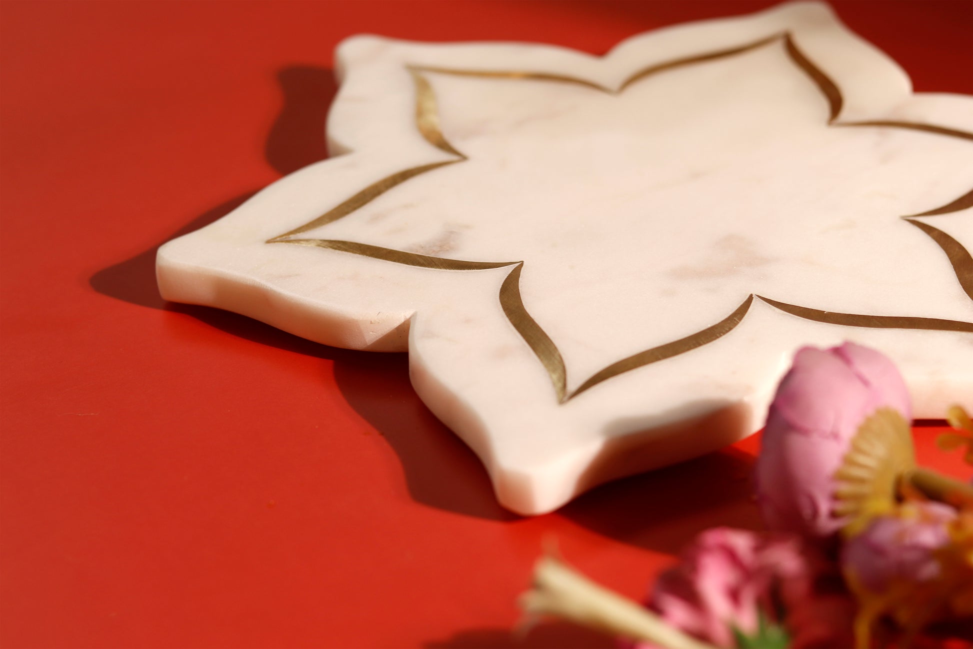 Marble lotus platter with brass inlay detail.