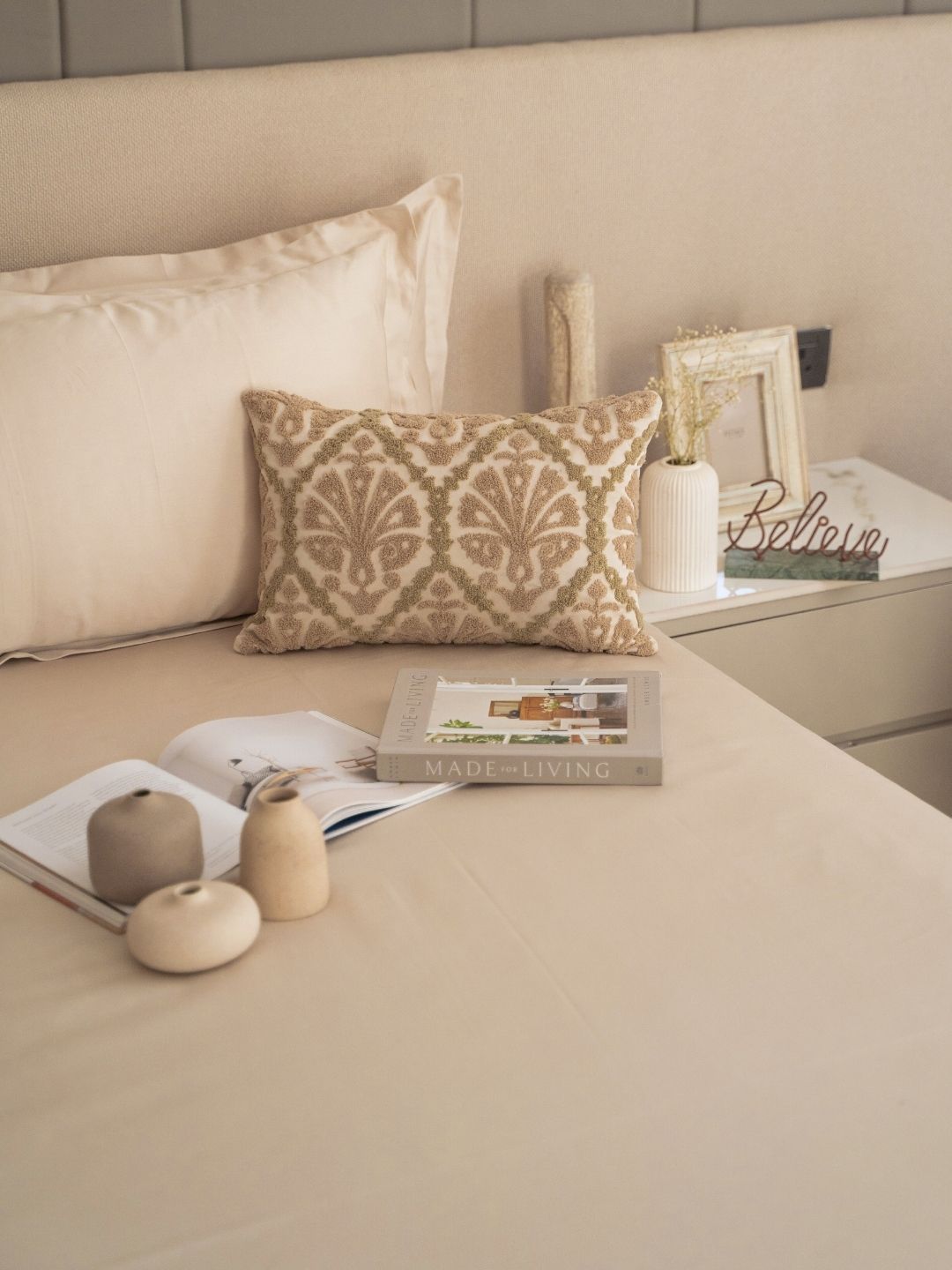 Oats beige bedsheet set styled on a bed