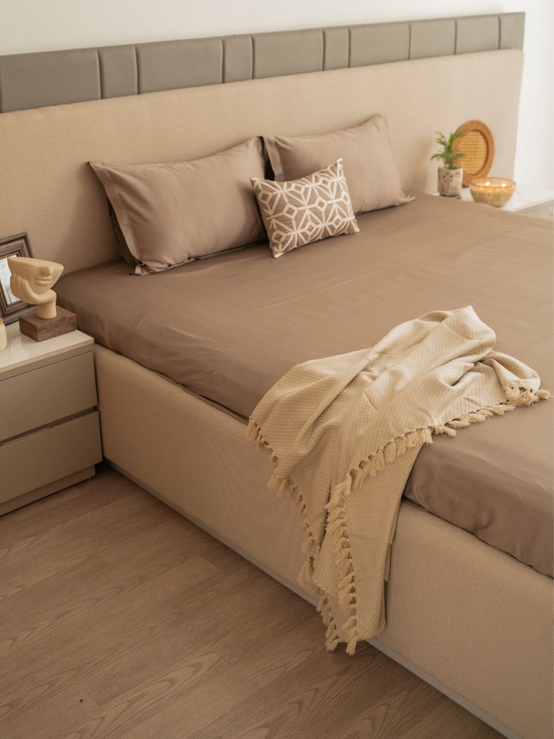 Azure mocha bedsheet set with accent cushion styled on bed
