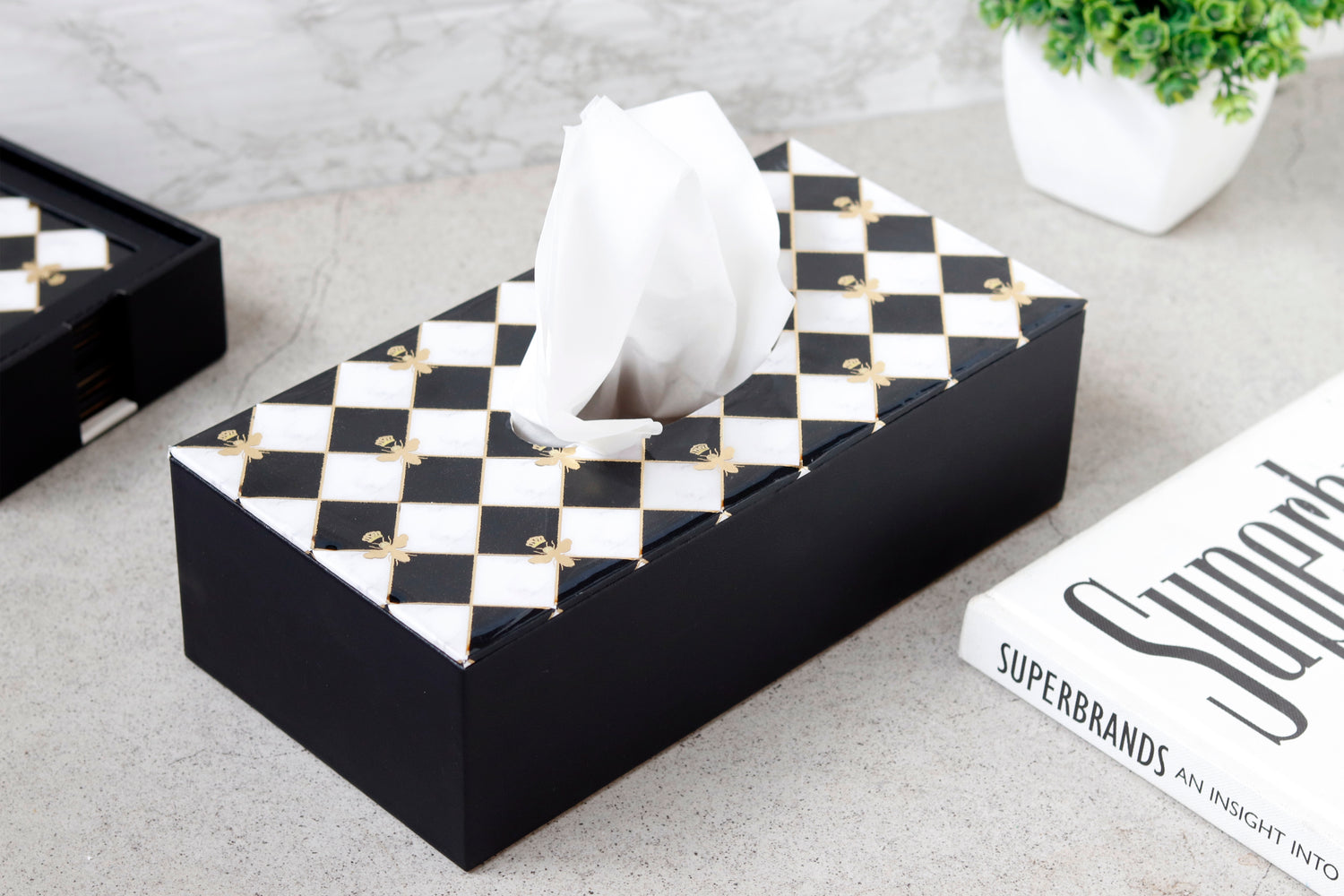 Bumblebee tissue holder with checkered design and golden bumblebee accents.
