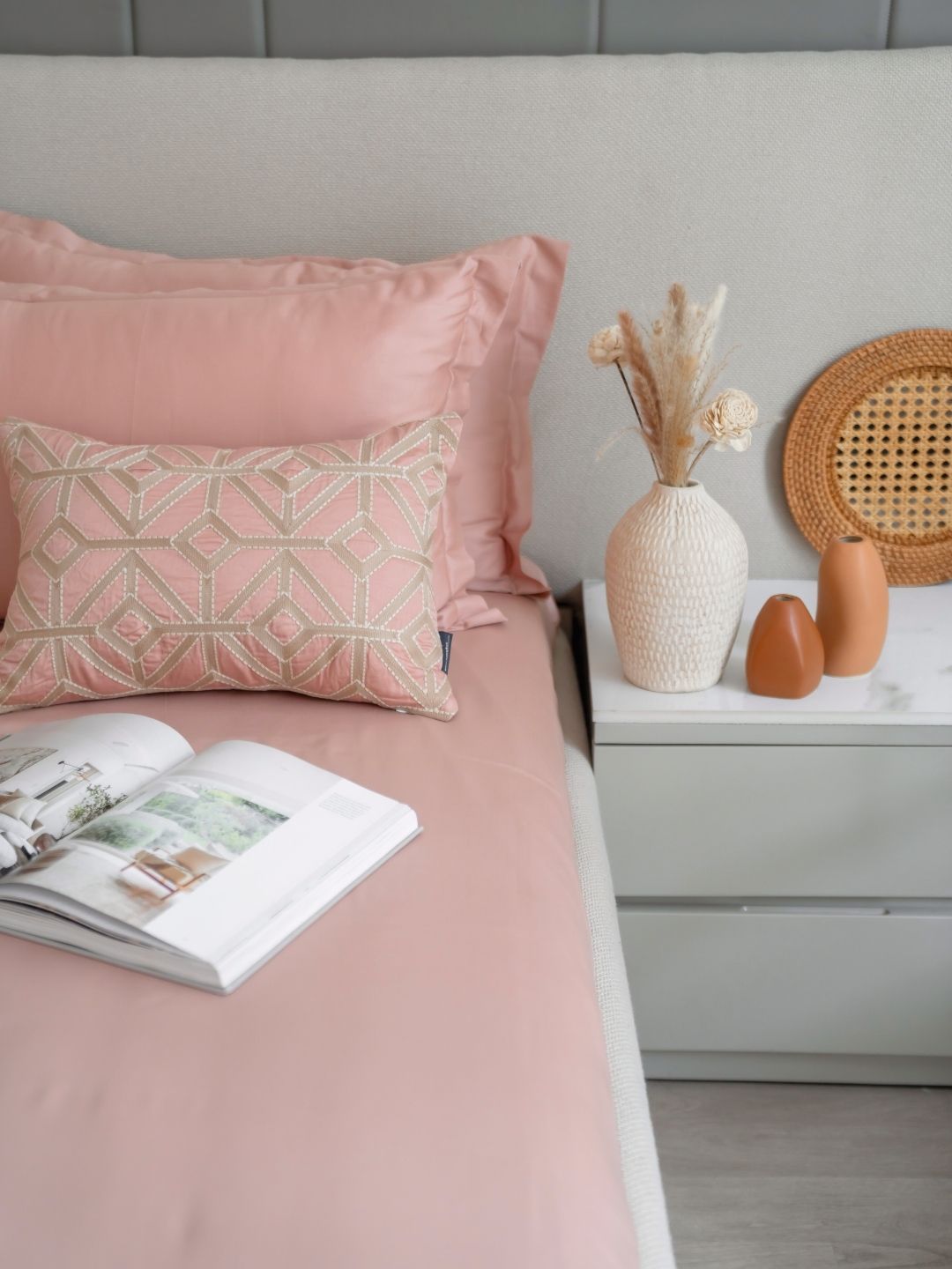 Rose colored bedsheet set styled on a bed