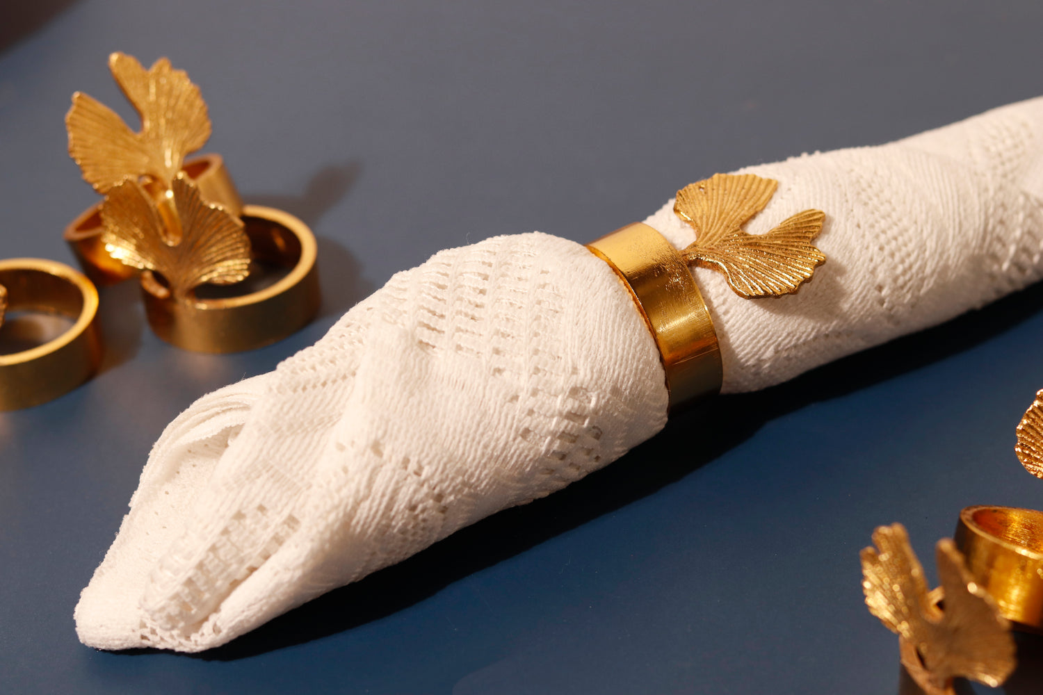 Elegant gold leaf napkin rings for dining and table decor.