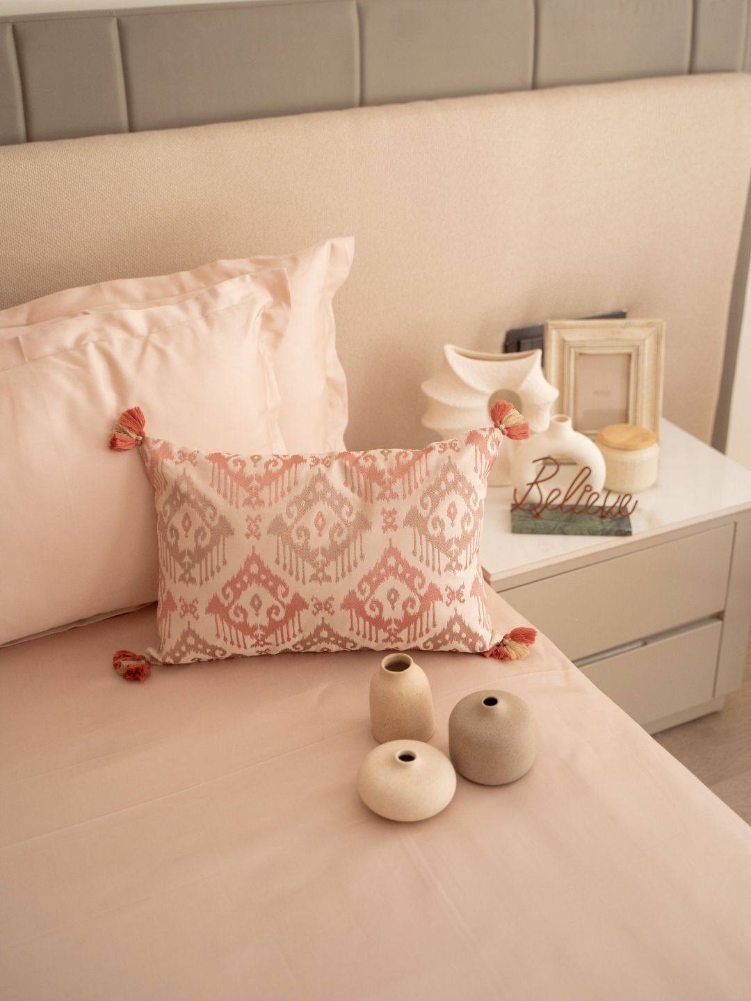 Buff colored bedsheet set styled on a bed