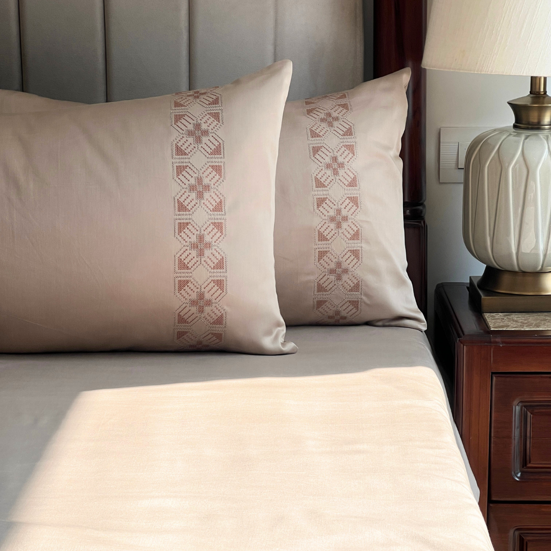 Close-up of Allure sand embroidered pillow cover