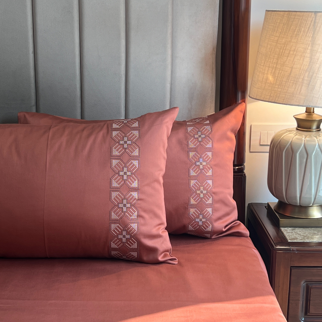Full bed styled with terracotta Dreams collection bedsheet set