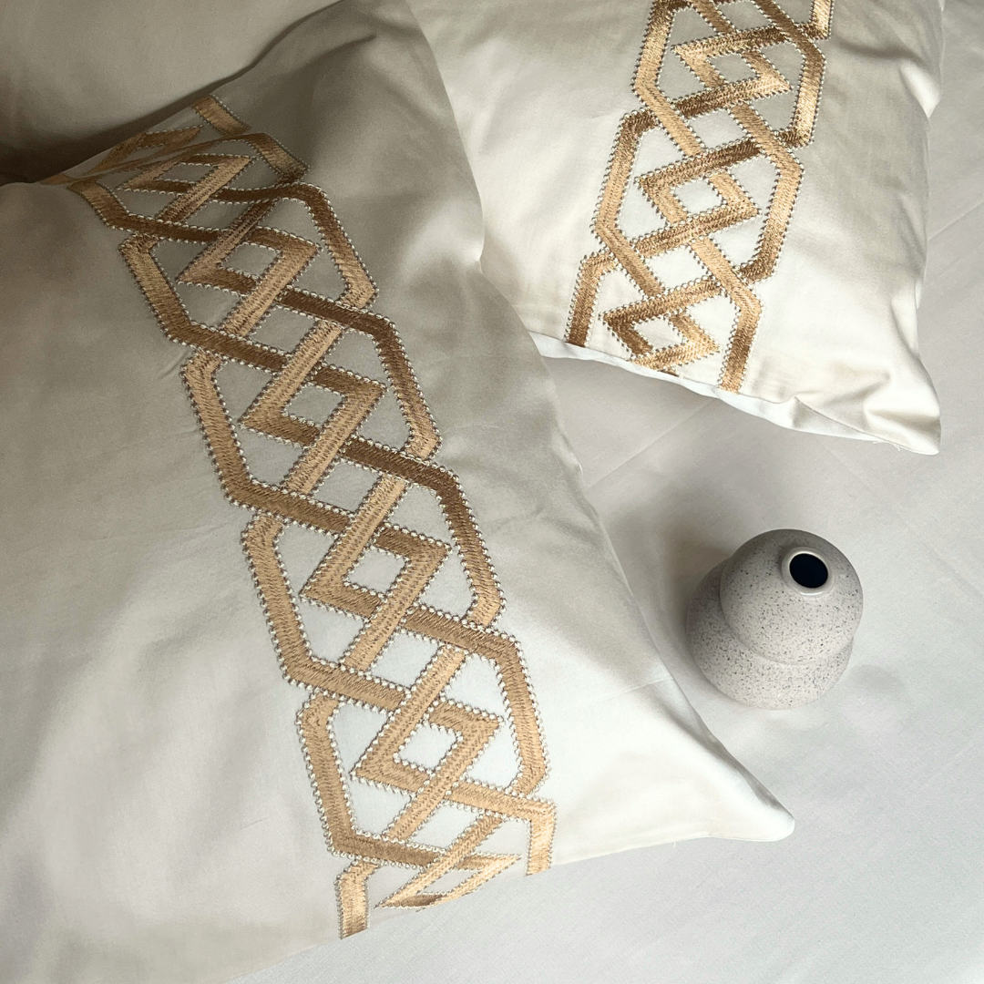 Close-up of oats beige embroidered pillow cover