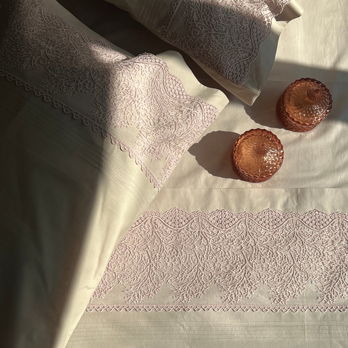 Full bed styled with almond beige Chantilly bedsheet set