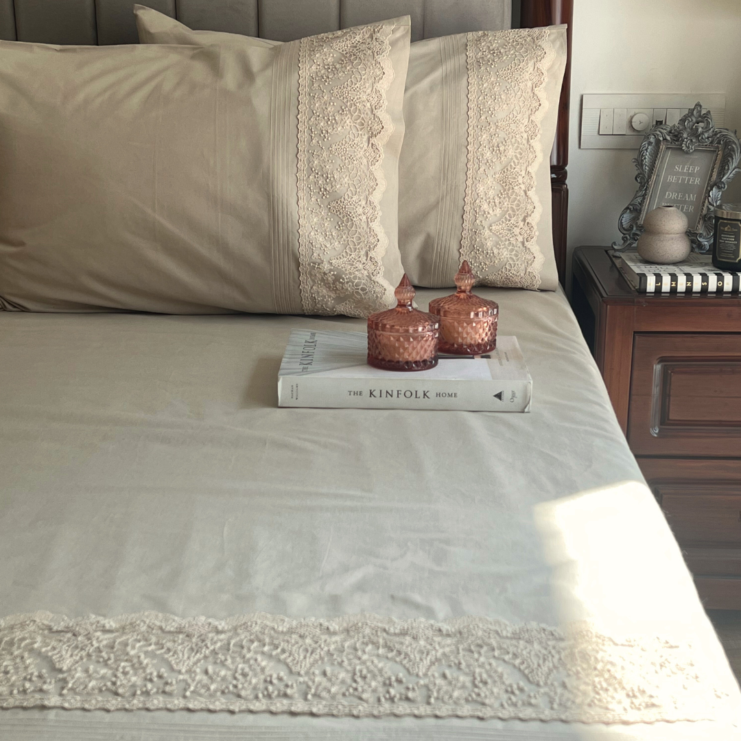 Close-up of desert beige embroidered lace pillow cover