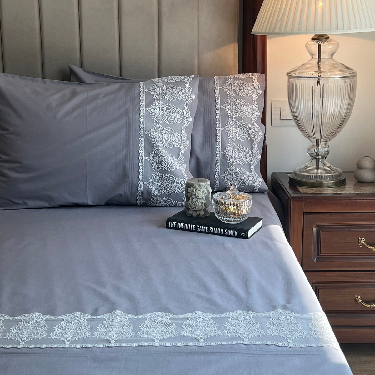 Close-up of elephant grey embroidered lace pillow cover