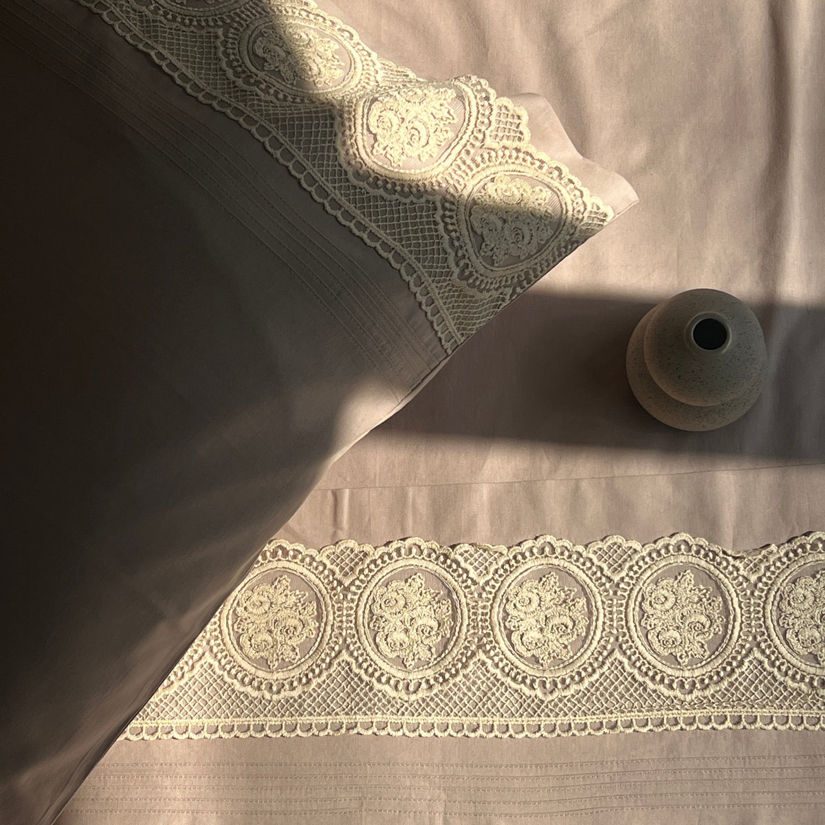 Full bed styled with mocha Chantilly bedsheet set