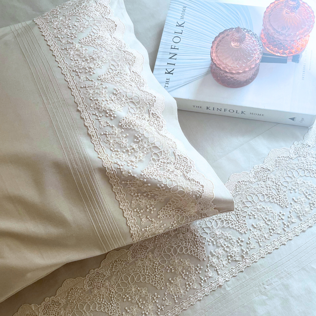 Close-up of oats beige embroidered lace pillow cover
