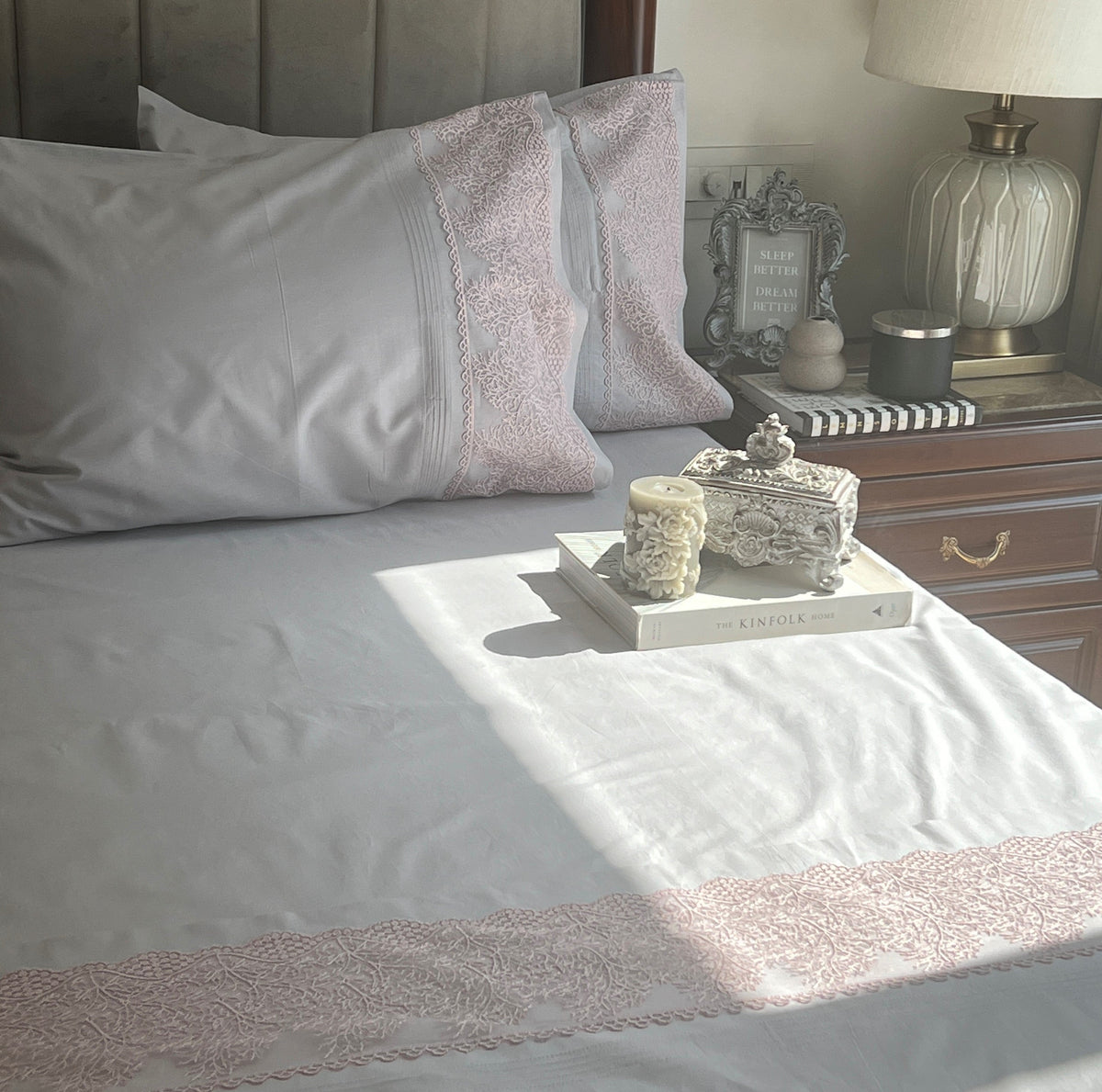 Close-up of pearl grey embroidered lace pillow cover