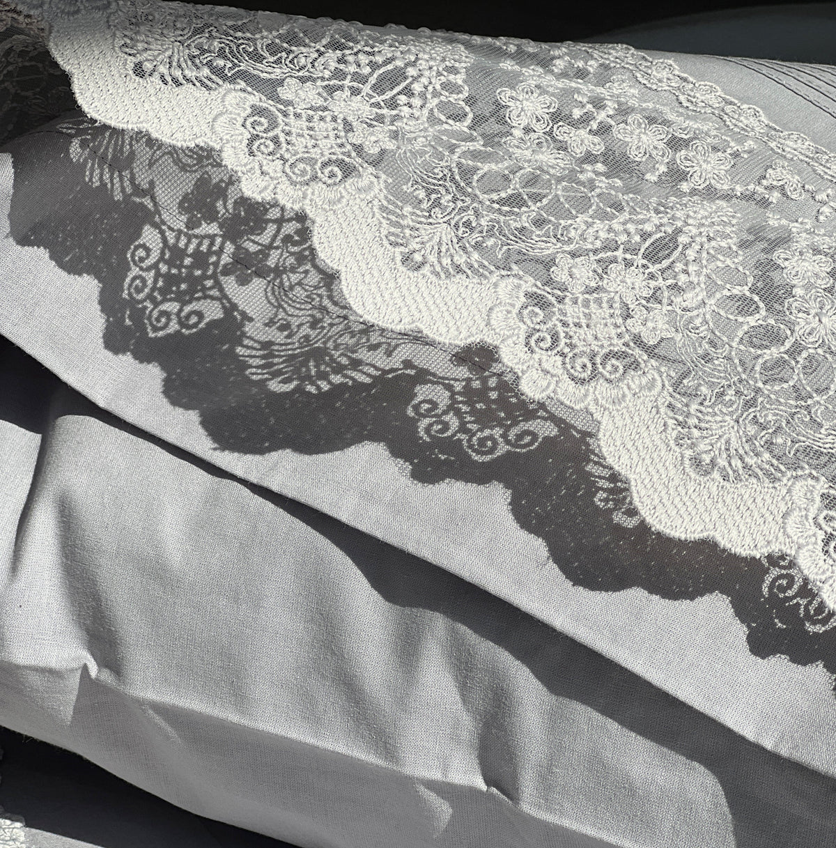 Full bed styled with slate Chantilly bedsheet set